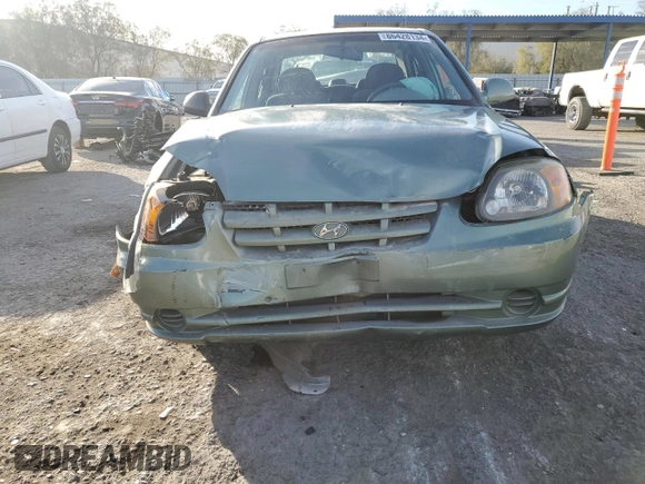 2004 Hyundai Accent GL with VIN KMHCG45C44U531828, listed as a Copart auction lot 86428134 with 92,054 mi miles and Salvage Title. Bid and sale history available at carsss.com. Image 5.