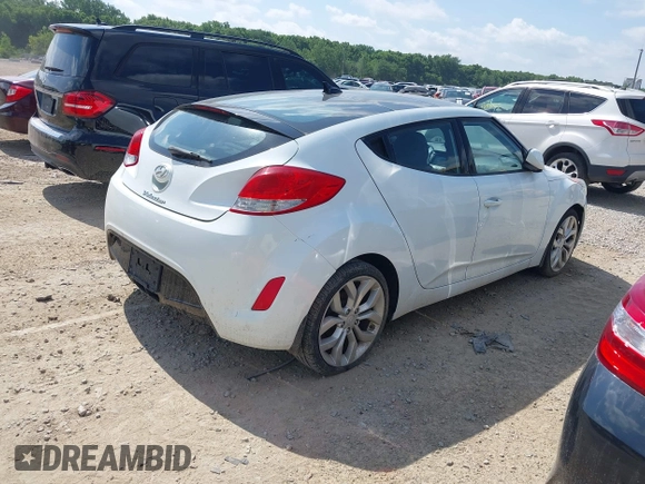 2013 Hyundai Veloster w/Black Int with VIN KMHTC6AD2DU131983, listed as a IAAI auction lot 42671646 with 131,731 mi miles and . Bid and sale history available at DreamBid. Image 4.