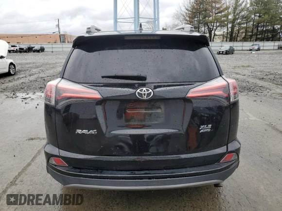 2018 Toyota RAV4 XLE with VIN 2T3RFREVXJW723057, listed as a Copart auction lot 49176705 with 5,980 mi miles and Salvage Title. Bid and sale history available at DreamBid. Image 6.