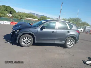 2014 Mazda CX-5 Sport with VIN JM3KE2BE4E0414721, listed as a IAAI auction lot 41408914 with Not Provided miles and . Bid and sale history available at carsss.com. Image 14.