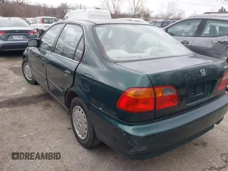 2000 Honda Civic LX with VIN 1HGEJ6673YL069805, listed as a IAAI auction lot 41511192 with 80,097 mi miles. Bid and sale history available at carsss.com. Image 3.