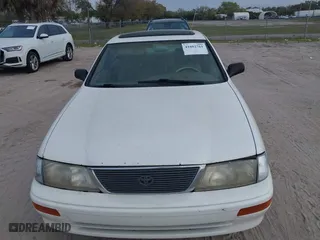 1997 Toyota Avalon XL with VIN 4T1BF12B1VU144017, listed as a IAAI auction lot 41602761 with 163,955 mi miles. Bid and sale history available at carsss.com. Image 6.