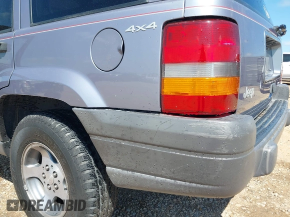 1996 Jeep Grand Cherokee with VIN 1J4EZ58S5TC149533, listed as a IAAI auction lot 42456529 with 173,872 mi miles and . Bid and sale history available at DreamBid. Image 6.