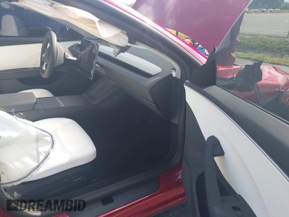 2025 Tesla Model 3 Long Range with VIN 5YJ3E1EA6SF967254, listed as a IAAI auction lot 42345651 with 1,180 mi miles and . Bid and sale history available at DreamBid. Image 5.