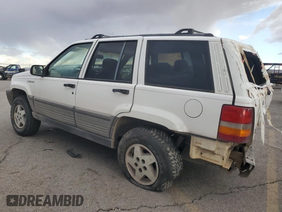 1995 Jeep Grand Cherokee Laredo with VIN 1J4GZ58Y6SC718918, listed as a Copart auction lot 72226394 with 212,670 mi miles and Salvage Title. Bid and sale history available at carsss.com. Image 2.