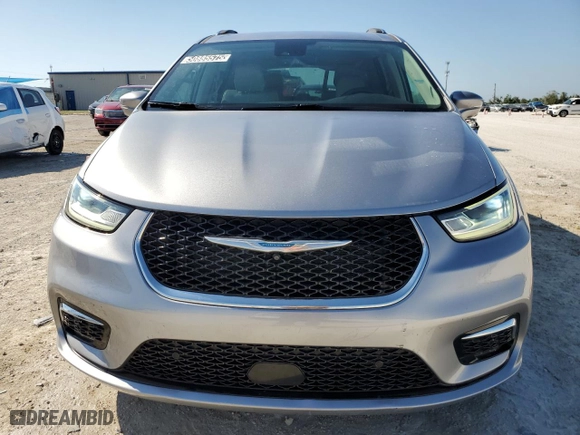 2021 Chrysler Pacifica Hybrid Touring L with VIN 2C4RC1L71MR594686, listed as a Copart auction lot 50885575 with 64,792 mi miles and Clean Title. Bid and sale history available at carsss.com. Image 5.