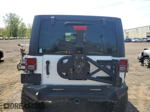 2013 Jeep Wrangler Unlimited Rubicon with VIN 1C4HJWFG2DL549064, listed as a Copart auction lot 56474055 with 148,217 mi miles and Salvage title. Bid and sale history available at DreamBid. Image 6.