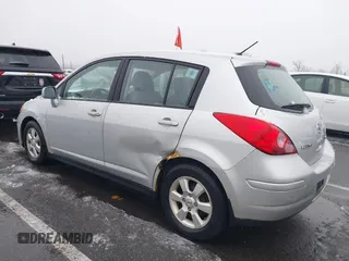 2009 Nissan Versa 1.8 SL with VIN 3N1BC13E59L420840, listed as a IAAI auction lot 41503232 with 129,824 mi miles. Bid and sale history available at carsss.com. Image 6.