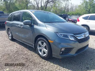 2018 Honda Odyssey EX-L z VIN 5FNRL6H77JB096733, wystawiony jako IAAI lot #42133737 z przebiegiem 165 069 mil mil oraz . Historia ofert i sprzedaży dostępna na DreamBid. Obrazek 1.