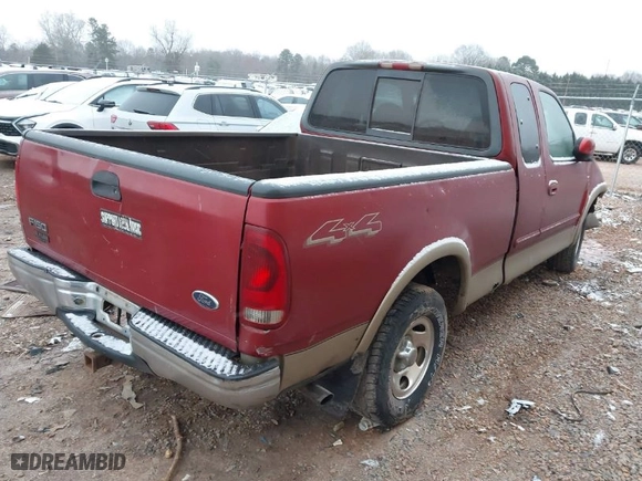 2000 Ford F-150 XL with VIN 1FTRX18L6YNA92785, listed as a IAAI auction lot 41618404 with 136,991 mi miles. Bid and sale history available at carsss.com. Image 4.