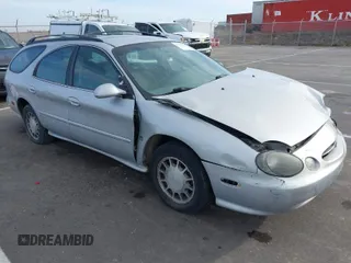 1999 Ford Taurus SE z VIN 1FAFP58S4XA299009, wystawiony jako IAAI lot #41775412 z przebiegiem 80 634 mil mil oraz . Historia ofert i sprzedaży dostępna na DreamBid. Obrazek 1.