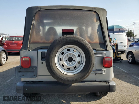 2000 Jeep Wrangler SE with VIN 1J4FA29P3YP770094, listed as a Copart auction lot 65419385 with 150,364 mi miles and Clean title. Bid and sale history available at DreamBid. Image 6.