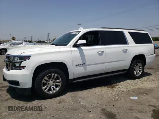 2019 Chevrolet Suburban LT with VIN 1GNSCHKCXKR207233, listed as a Copart auction lot 55410464 with 107,500 mi miles and Salvage Title. Bid and sale history available at DreamBid. Image 1.