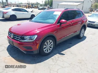 2018 Volkswagen Tiguan S with VIN 3VV1B7AX4JM043324, listed as a IAAI auction lot 42623550 with 62,858 mi miles and . Bid and sale history available at DreamBid. Image 2.