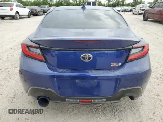 2023 Toyota GR86 with VIN JF1ZNBC18P8763359, listed as a Copart auction lot 67415424 with 23,954 mi miles and Salvage Title. Bid and sale history available at carsss.com. Image 6.