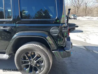 2023 Jeep Wrangler 4xe Sahara with VIN 1C4JJXP62PW613040, listed as a IAAI auction lot 41489171 with 36,818 mi miles. Bid and sale history available at carsss.com. Image 21.