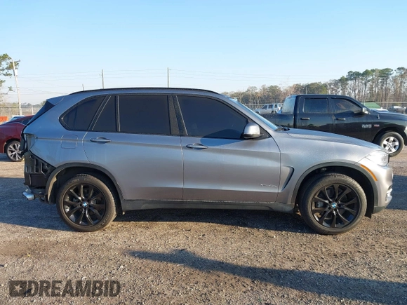 2016 BMW X5 xDrive40e with VIN 5UXKT0C57G0S75476, listed as a IAAI auction lot 41642249 with 105,489 mi miles and . Bid and sale history available at DreamBid. Image 14.
