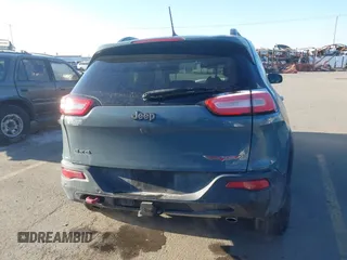 2015 Jeep Cherokee Trailhawk with VIN 1C4PJMBS3FW510219, listed as a IAAI auction lot 41440297 with 144,012 mi miles and . Bid and sale history available at DreamBid. Image 14.