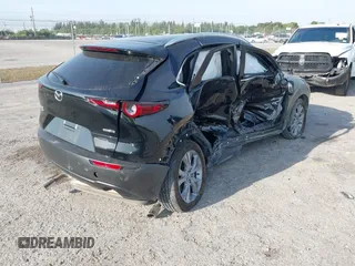 2024 Mazda CX-30 S Preferred with VIN 3MVDMBCM0RM669099, listed as a IAAI auction lot 41864473 with 6,278 mi miles and . Bid and sale history available at DreamBid. Image 4.