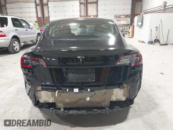 2023 Tesla Model 3 with VIN 5YJ3E1EA5PF552241, listed as a IAAI auction lot 41876487 with 18,533 mi miles and . Bid and sale history available at carsss.com. Image 16.