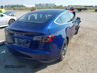2018 Tesla Model 3 Long Range Battery with VIN 5YJ3E1EA6JF027065, listed as a IAAI auction lot 40532631 with 55,316 mi miles. Bid and sale history available at carsss.com. Image 4.