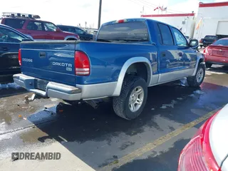 2003 Dodge Dakota SLT with VIN 1D7HL48N73S333828, listed as a IAAI auction lot 41748642 with 163,258 mi miles. Bid and sale history available at carsss.com. Image 4.
