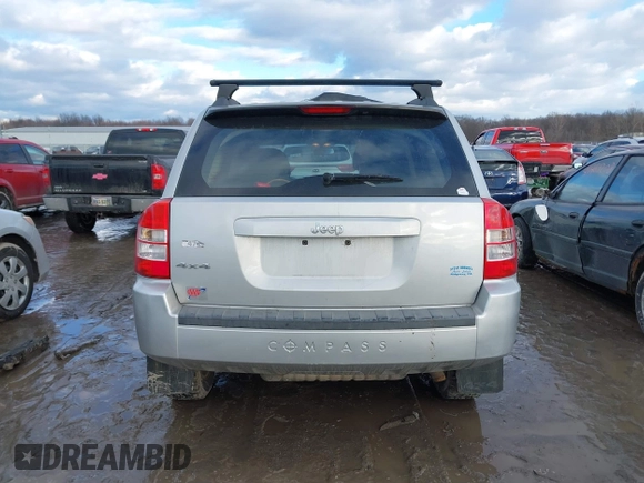 2010 Jeep Compass Sport with VIN 1J4NF4FB3AD589361, listed as a IAAI auction lot 41449412 with 127,807 mi miles. Bid and sale history available at carsss.com. Image 15.
