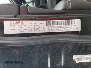 2015 Jeep Grand Cherokee Overland with VIN 1C4RJFCT2FC762573, listed as a Copart auction lot 59123275 with 229,128 mi miles and Salvage title. Bid and sale history available at DreamBid. Image 12.