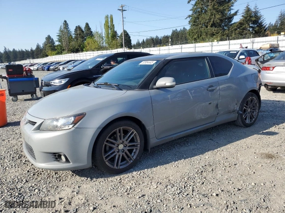 2011 Scion tC with VIN JTKJF5C76B3000765, listed as a Copart auction lot 53954445 with 243,554 mi miles and Salvage Title. Bid and sale history available at carsss.com. Image 1.