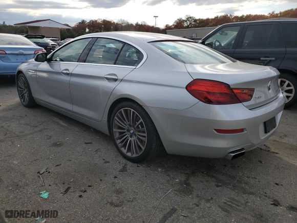 2016 BMW 6 Series 650i xDrive with VIN WBA6D6C52GG387898, listed as a Copart auction lot 77109254 with 106,134 mi miles and Salvage Title. Bid and sale history available at carsss.com. Image 2.
