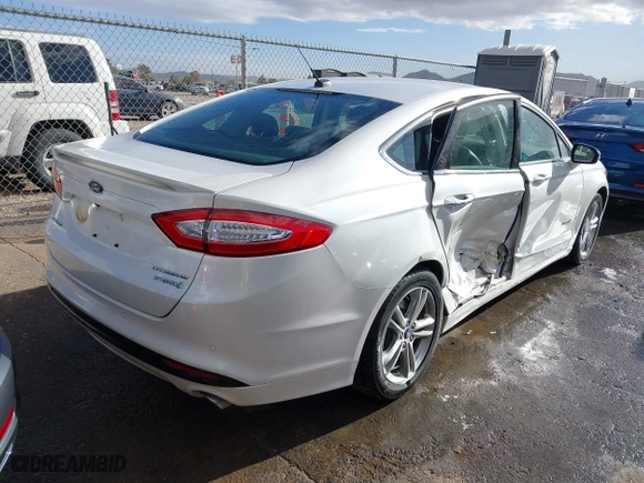2015 Ford Fusion Titanium Hybrid with VIN 3FA6P0RU9FR308973, listed as a IAAI auction lot 41754320 with 82,686 mi miles. Bid and sale history available at carsss.com. Image 4.