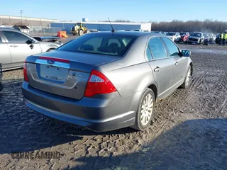 2010 Ford Fusion Hybrid with VIN 3FADP0L39AR125251, listed as a IAAI auction lot 41100606 with 235,612 mi miles. Bid and sale history available at carsss.com. Image 4.