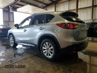 2014 Mazda CX-5 Touring z VIN JM3KE4CY5E0393463, wystawiony jako Copart lot #57776665 z przebiegiem 91 565 mil mil oraz Szkoda całkowita • Salvage title. Historia ofert i sprzedaży dostępna na DreamBid. Obrazek 2.