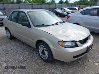 2001 Mazda Protege LX z VIN JM1BJ226210439446, wystawiony jako IAAI lot #42336976 z przebiegiem 155 990 mil mil oraz . Historia ofert i sprzedaży dostępna na DreamBid. Obrazek 1.