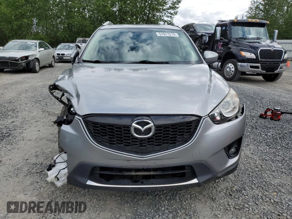 2014 Mazda CX-5 Touring z VIN JM3KE4CY0E0407169, wystawiony jako Copart lot #57877215 z przebiegiem 168 277 mil mil oraz Szkoda całkowita • Salvage title. Historia ofert i sprzedaży dostępna na DreamBid. Obrazek 5.