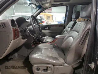 2004 GMC Envoy SLT with VIN 1GKDT13S842421586, listed as a Copart auction lot 51936515 with 188,977 mi miles and Salvage title. Bid and sale history available at DreamBid. Image 7.