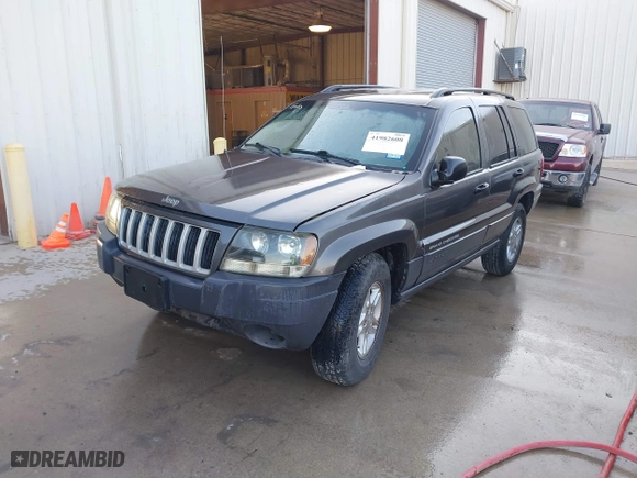 2004 Jeep Grand Cherokee Laredo with VIN 1J4GX48S04C394024, listed as a IAAI auction lot 41982608 with 142,825 mi miles. Bid and sale history available at carsss.com. Image 2.