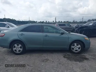 2007 Toyota Camry CE with VIN 4T1BE46K37U569515, listed as a IAAI auction lot 41974482 with 242,042 mi miles. Bid and sale history available at carsss.com. Image 13.