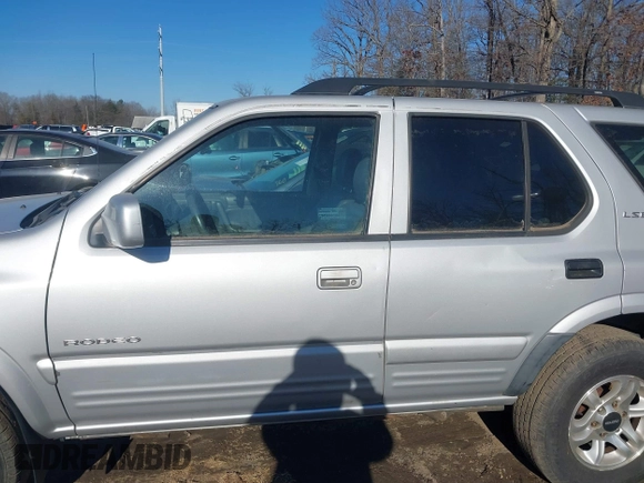 2002 Isuzu Rodeo z VIN 4S2DM58W524317574, wystawiony jako IAAI lot #41604546 z przebiegiem 150 000 mil mil oraz . Historia ofert i sprzedaży dostępna na DreamBid. Obrazek 6.