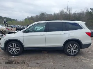 2017 Honda Pilot Elite with VIN 5FNYF6H04HB042192, listed as a IAAI auction lot 41780875 with 158,491 mi miles and . Bid and sale history available at DreamBid. Image 14.