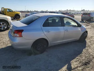 2011 Toyota Yaris with VIN JTDBT4K35B1409879, listed as a Copart auction lot 88090195 with 133,900 mi miles and Salvage Title. Bid and sale history available at carsss.com. Image 3.