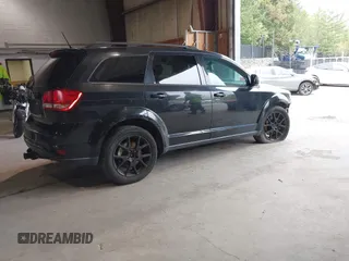 2013 Dodge Journey SXT with VIN 3C4PDDBG0DT660956, listed as a IAAI auction lot 41593385 with 196,021 mi miles and . Bid and sale history available at DreamBid. Image 4.