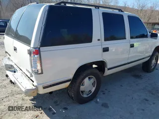 1999 GMC Yukon with VIN 1GKEK13R8XJ763098, listed as a IAAI auction lot 41753745 with 209,451 mi miles. Bid and sale history available at carsss.com. Image 4.