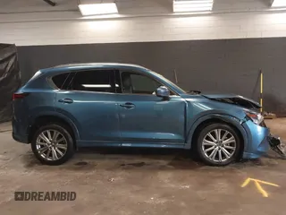 2023 Mazda CX-5 Signature with VIN JM3KFBXY4P0120187, listed as a IAAI auction lot 41706264 with 9,402 mi miles and . Bid and sale history available at carsss.com. Image 13.
