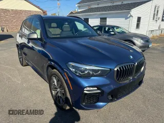 2021 BMW X5 M50i with VIN 5UXJU4C00M9H36466, listed as a Copart auction lot 77444344 with 100,119 mi miles and Clean Title. Bid and sale history available at carsss.com. Image 4.