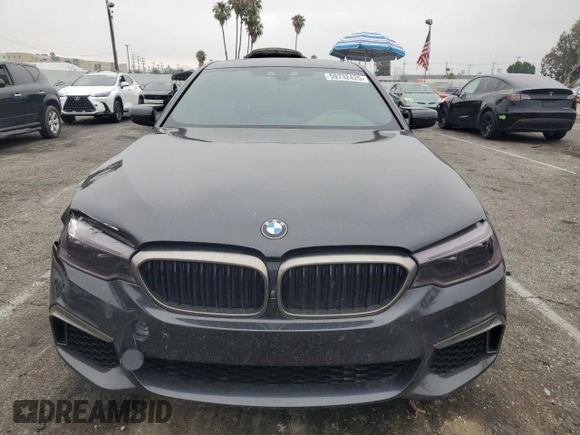 2019 BMW 5 Series M550i xDrive with VIN WBAJB9C59KB287501, listed as a Copart auction lot 59732425 with 74,345 mi miles and Salvage title. Bid and sale history available at DreamBid. Image 5.