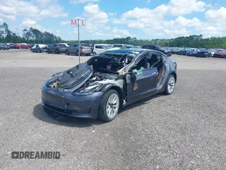 2022 Tesla Model 3 Long Range z VIN 5YJ3E1EB0NF124664, wystawiony jako IAAI lot #34246337 z przebiegiem Nie podano mil oraz . Historia ofert i sprzedaży dostępna na DreamBid. Obrazek 2.
