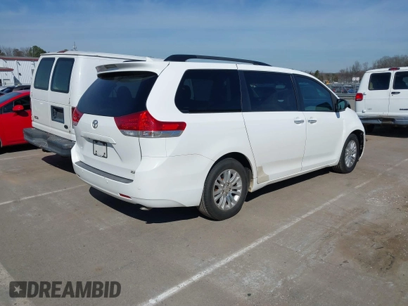 2011 Toyota Sienna XLE AAS with VIN 5TDYK3DCXBS043733, listed as a IAAI auction lot 41601544 with 221,658 mi miles and . Bid and sale history available at DreamBid. Image 4.