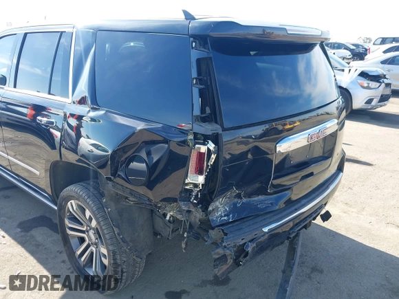 2019 GMC Yukon Denali with VIN 1GKS2CKJ4KR191886, listed as a IAAI auction lot 41198227 with 74,325 mi miles. Bid and sale history available at carsss.com. Image 6.