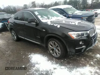 2015 BMW X4 xDrive28i with VIN 5UXXW3C57F0M87064, listed as a IAAI auction lot 38583109 with 171,930 mi miles. Bid and sale history available at carsss.com. Image 1.